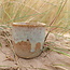 Contemporary, handmade ceramic cup from the tableware and collection “Musterd"