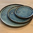 With the turntable handmade plate of Belgien clay with a beautiful Floating blue high-firing glaze.