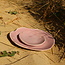 Handmade ceramic plate Amandine in shell shape and glazes pink of the "Chefs Artisann i-lign" for contemporary use as well as for catering.