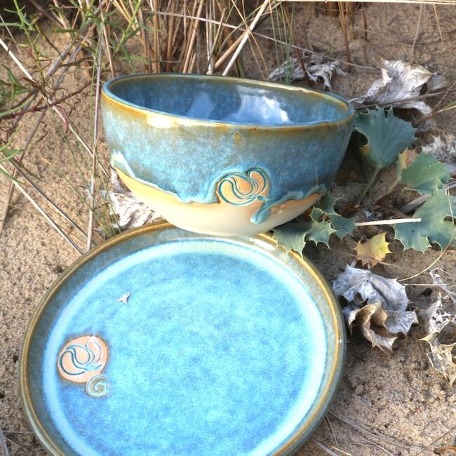 Handmade ceramic bowl with stamp