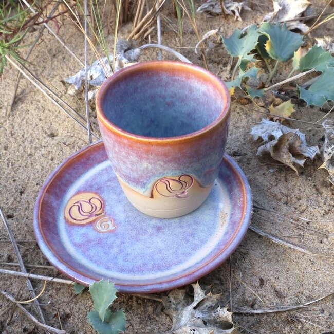 Handmade ceramic cup with stamp