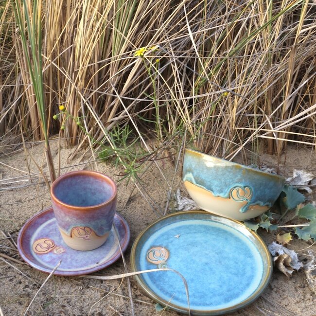 Handmade ceramic bowl with stamp