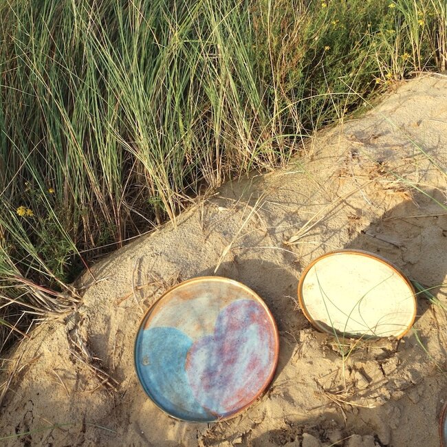 With the turntable handmade plate with speckled Pyerite clay and a beautiful mustard high firing glaze.