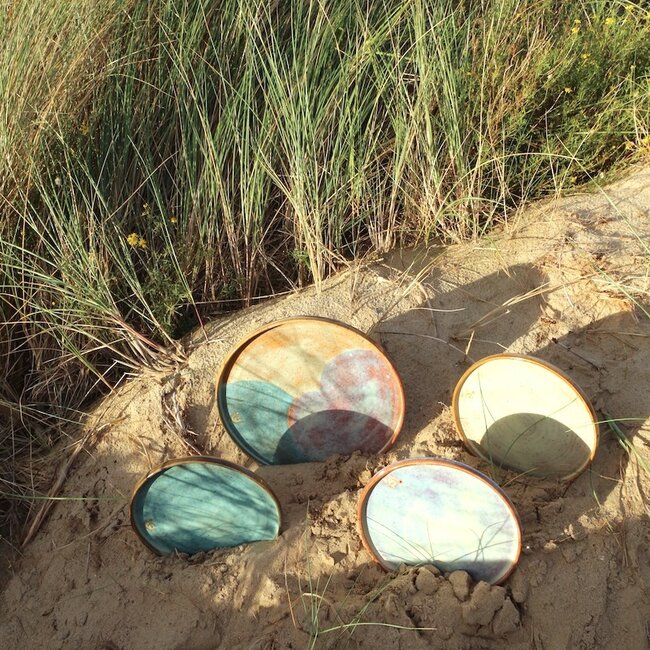 With the turntable handmade plate with speckled Pyerite clay and a beautiful mint high firing glaze.