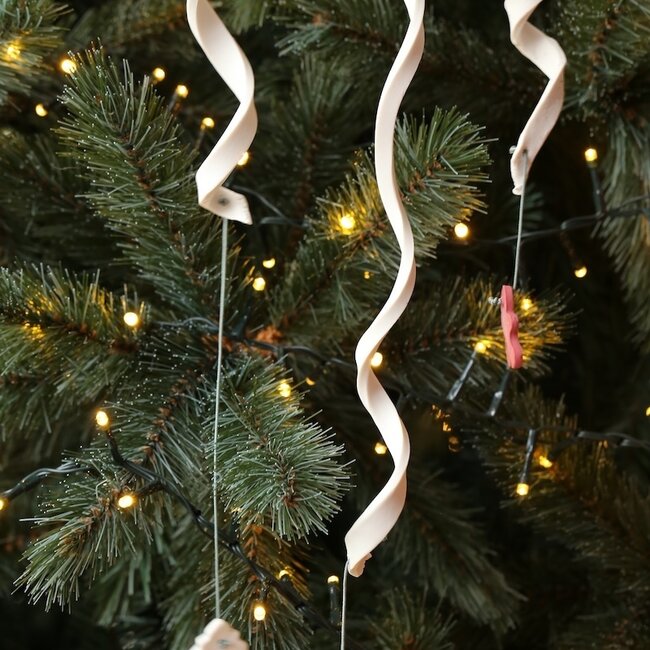Handmade porcelain icicle finished with a Christmas item
