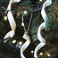 Handmade porcelain icicle finished with a Christmas item