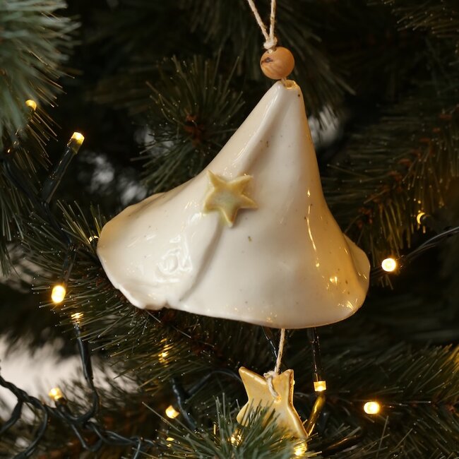 Handmade porcelain Christmas bell decorated with a star