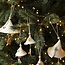 Handmade porcelain Christmas bell decorated with a Christmas tree
