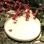 White handmade ceramic plate from the tableware and collection “White Heart" with a sungreen-colored heart