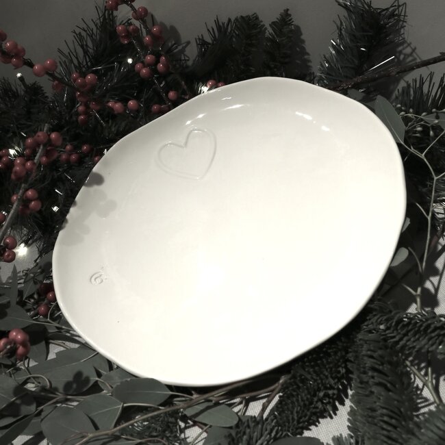 Unique handmade porcelain plate with a subtle heart incorporated