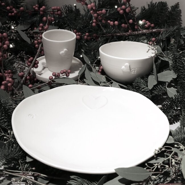 Unique handmade porcelain plate with a subtle heart incorporated