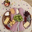 Golvende keramische handgemaakte tapaschaal Wave, Sunrise-Roos