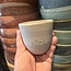 Handmade ceramic cup with name stamped on it