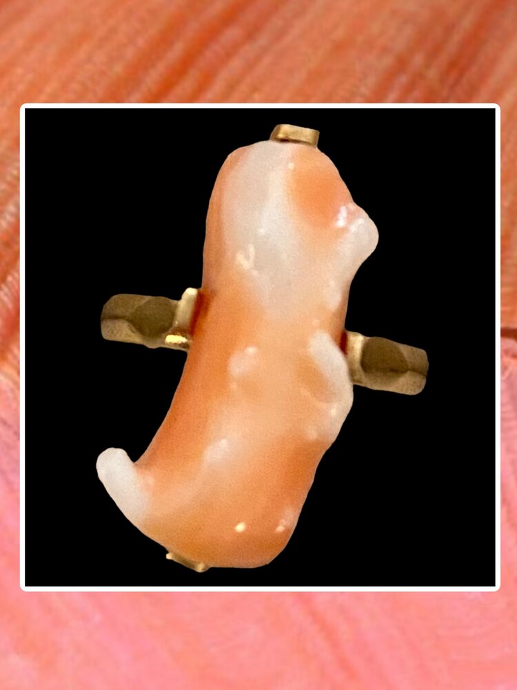 Unpolished Angelskin pink coral in a 14 crt gold setting