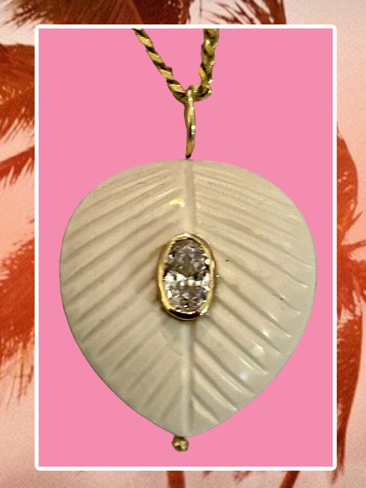 White stone leaf charm with pink Topaz in a 14 crt gold setting