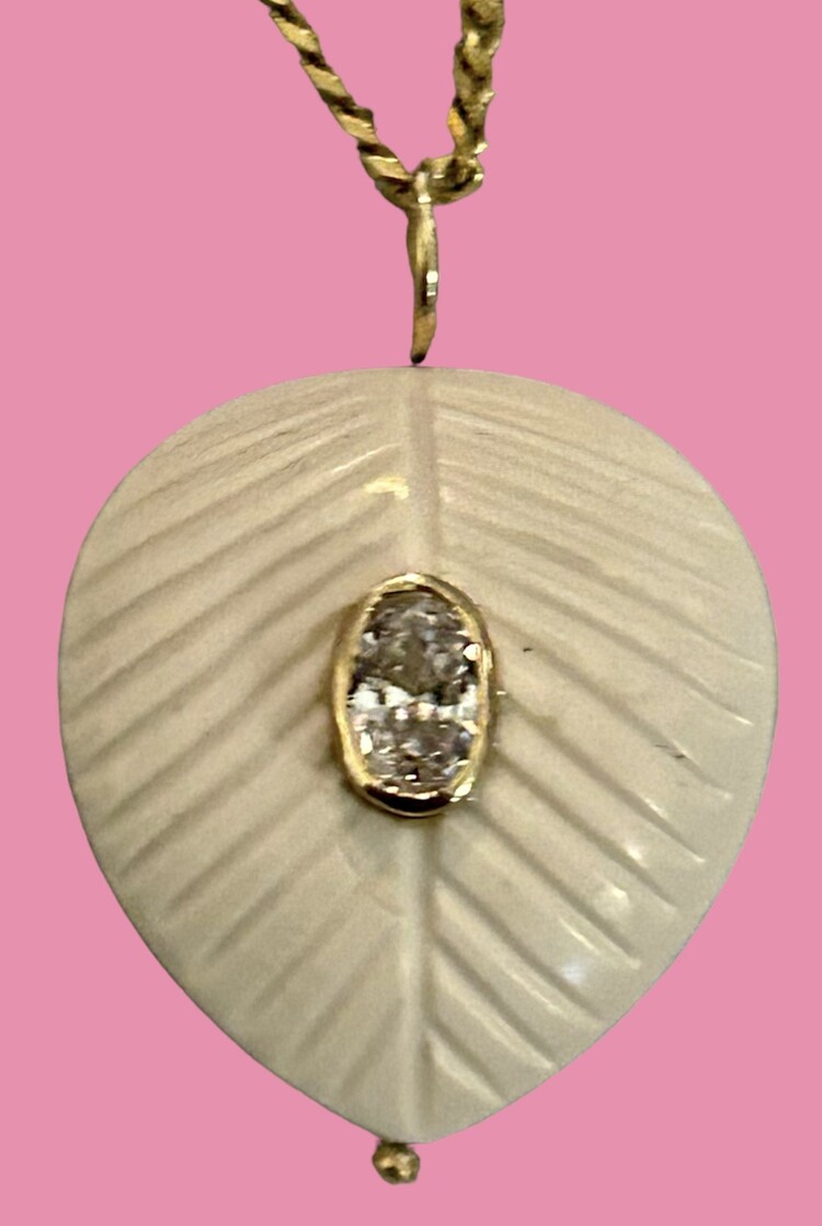 White stone leaf charm with pink Topaz in a 14 crt gold setting