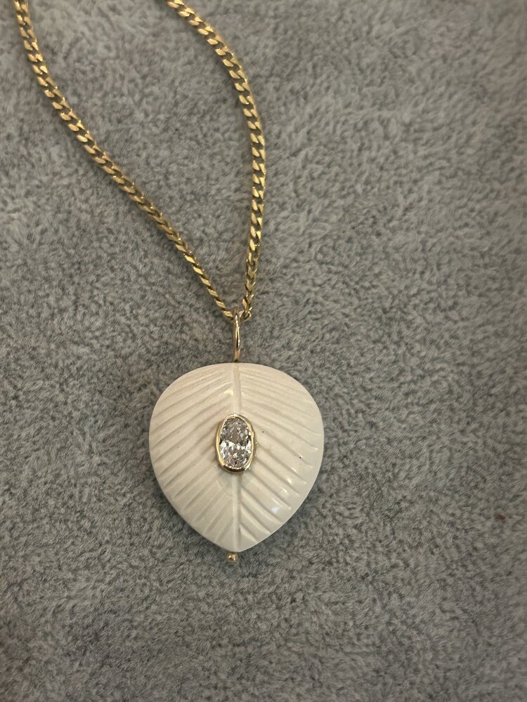 White stone leaf charm with pink Topaz in a 14 crt gold setting