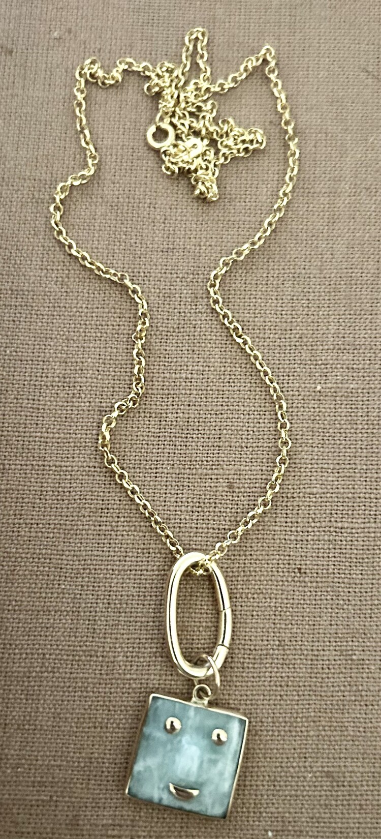 Happy face charm Jade with 14 crt gold details