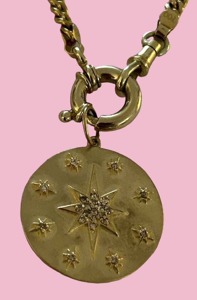 Large polished diamond starburst token 14 crt gold