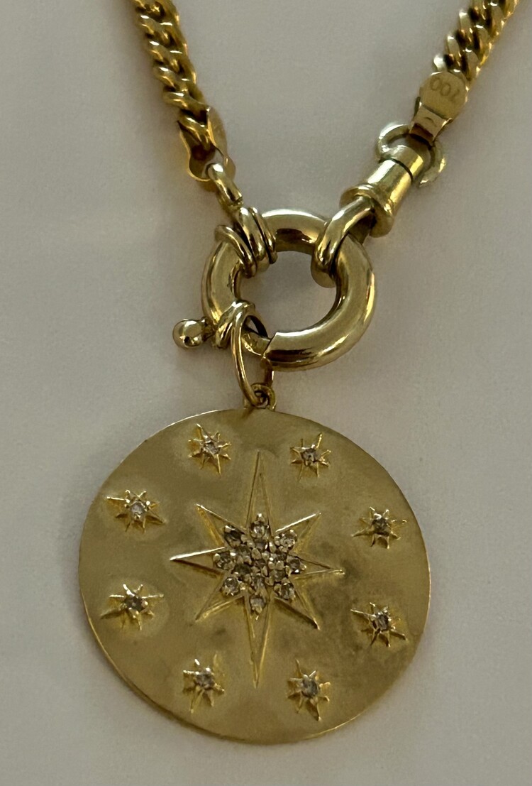 Large polished diamond starburst token 14 crt gold