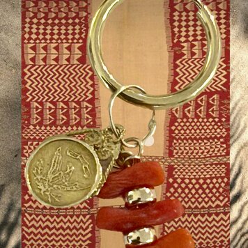 Coral branch eagle coin charm 14 crt gold