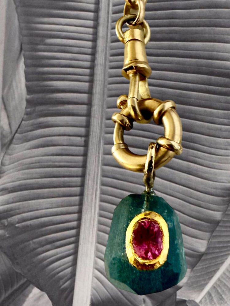 rough unpolished Emerald with Ruby inlay 18 crt