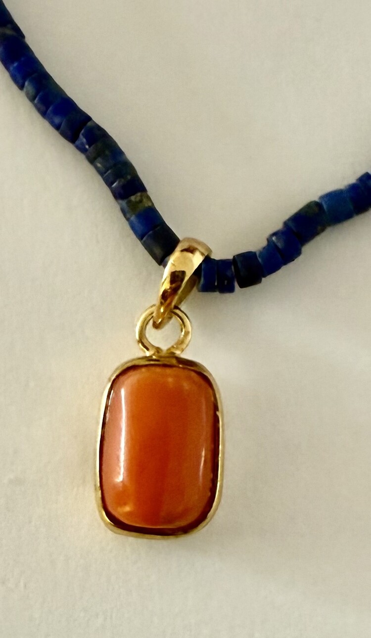 Natural antique Coral in 14 crt setting