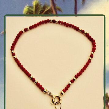 Coral and gold bead bracelet with diamond malachite charm