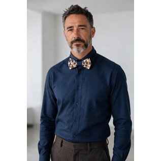 Wooden bowtie with a geometric triangle pattern.