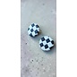 Handcrafted clay earrings with a black and white checkerboard pattern and butterfly backs.
