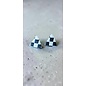 Handcrafted clay earrings with a black and white checkerboard pattern and butterfly backs.