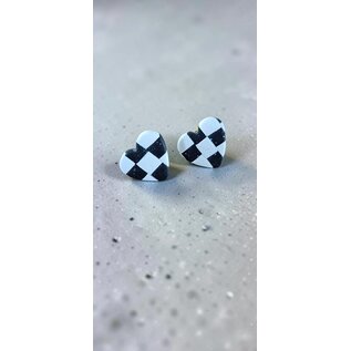 Handcrafted clay earrings with a black and white checkerboard pattern and butterfly backs.
