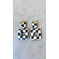 Handcrafted clay drop earrings in 2 parts with a black and white checkerboard pattern and butterfly backs.