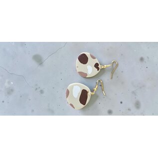 Handcrafted clay earrings with a terrazzo pattern.