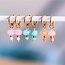 Koning Bamboe Stainless steel hoop earrings with faceted bead and stone - coral