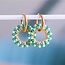 Oorbel met ronde facet hanger – groene tinten