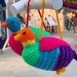 Hand knitted bird, coloured