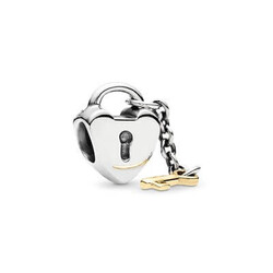 PRE-OWNED PANDORA 790288 zilveren bedel hart met geelgouden sleutel
