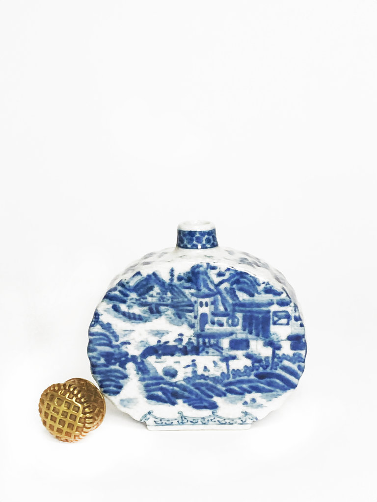 Blue white porcelain bottle with brass cap