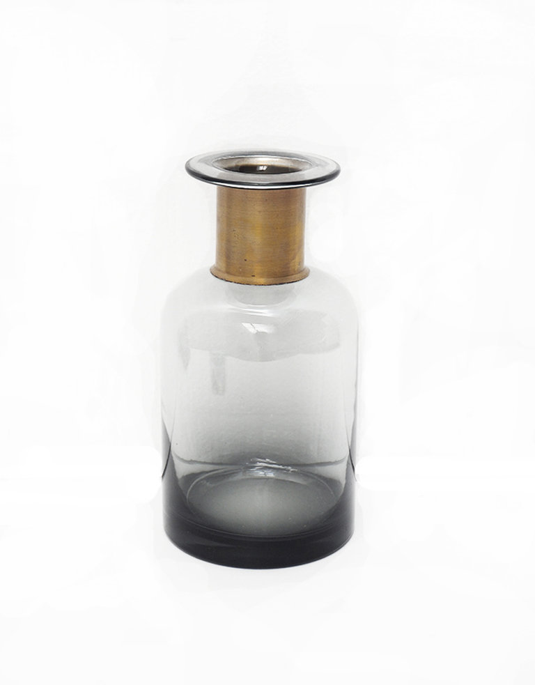 Grey pharmacy bottle with brass detail