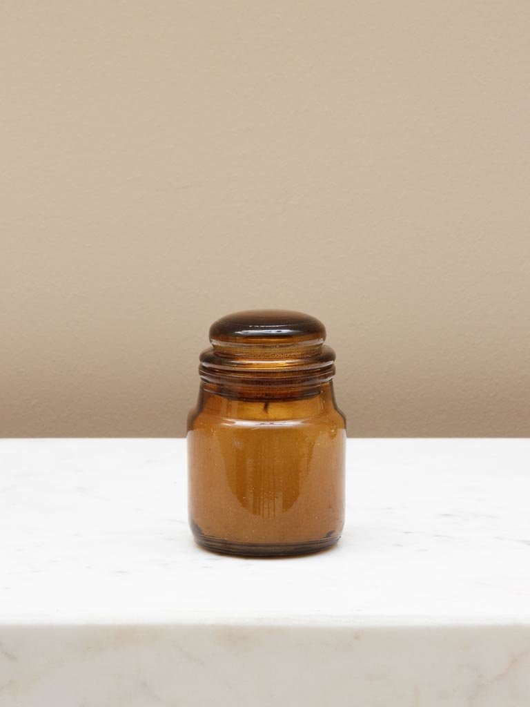 Small amber jar with candle
