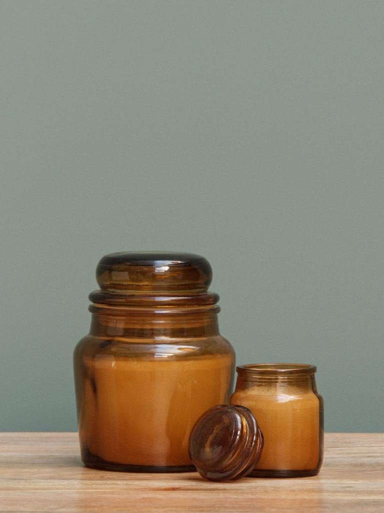 Small amber jar with candle