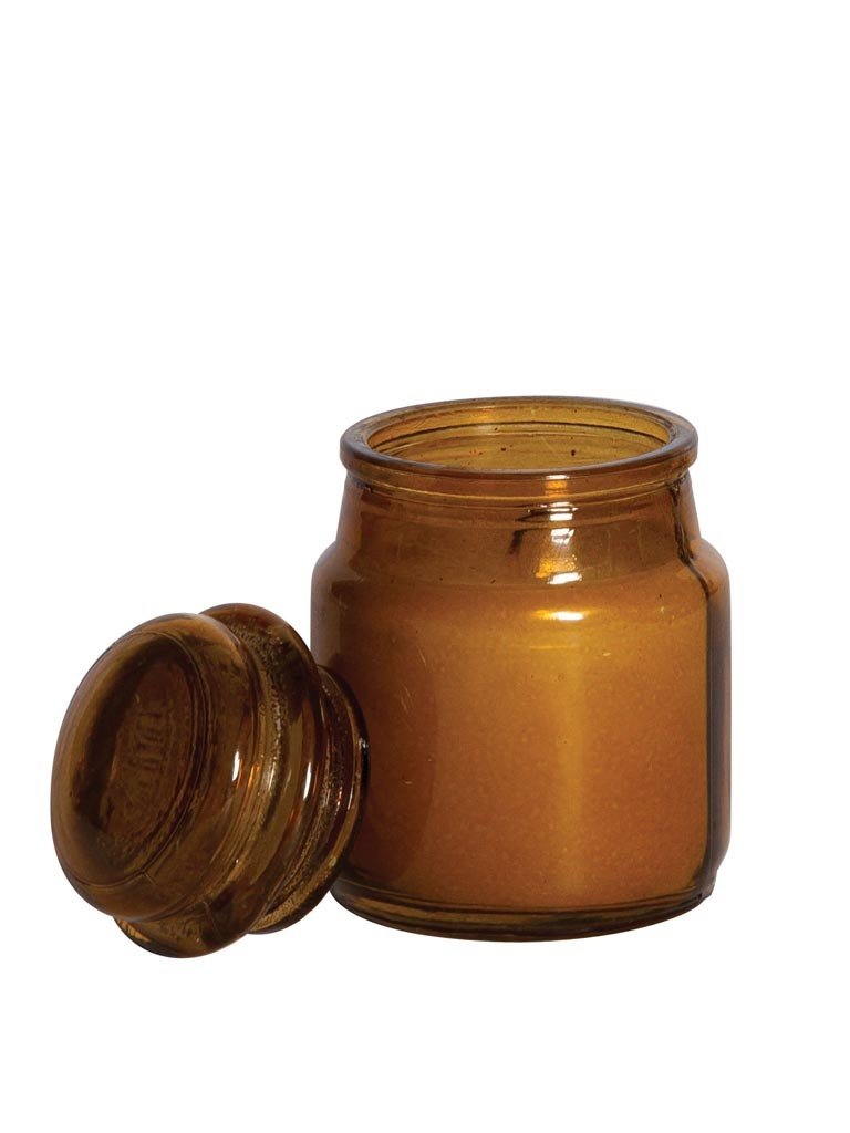 Small amber jar with candle