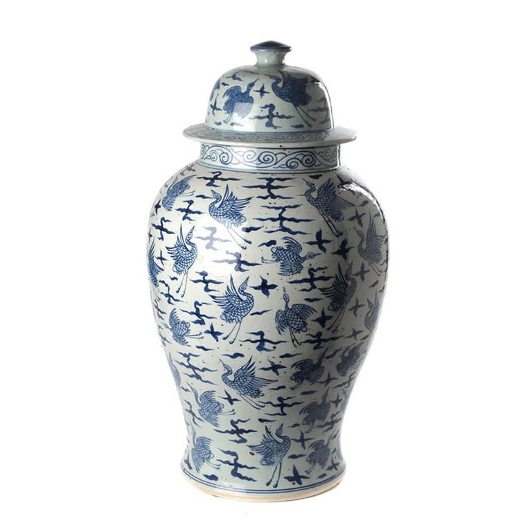 White and blue temple jar with storks