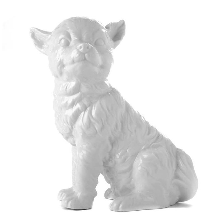 White porcelain sitting dog statue