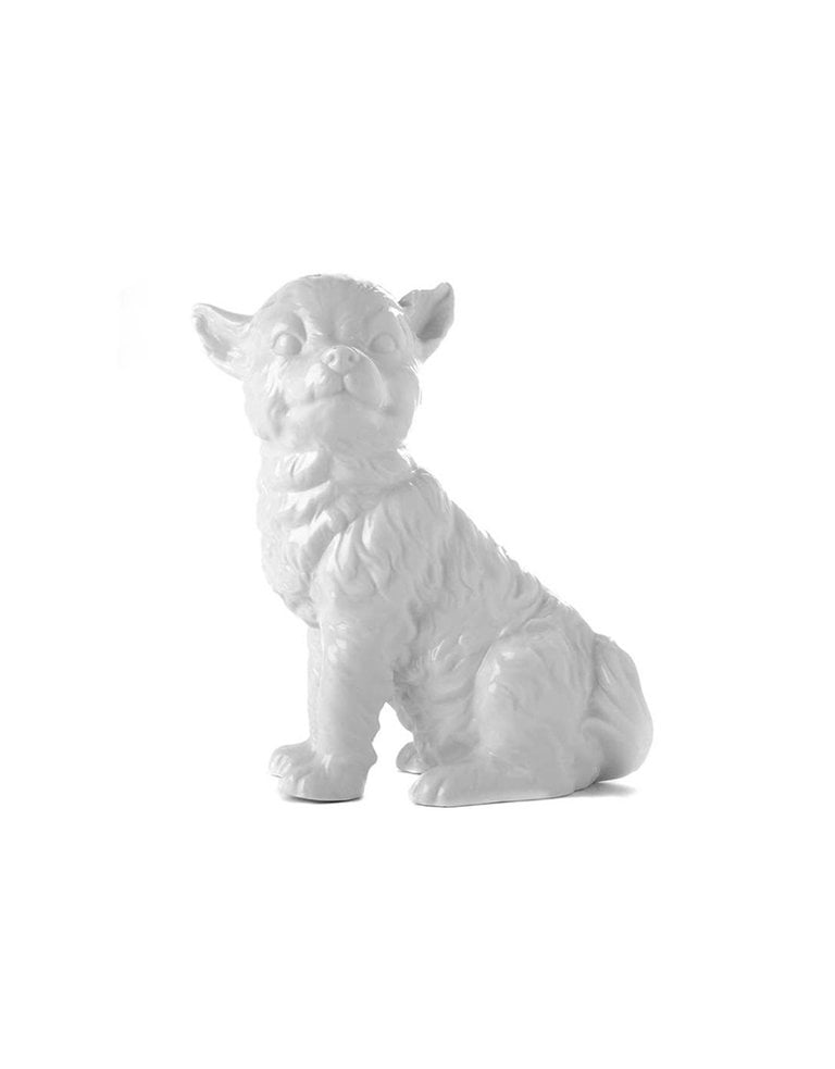 White porcelain sitting dog statue