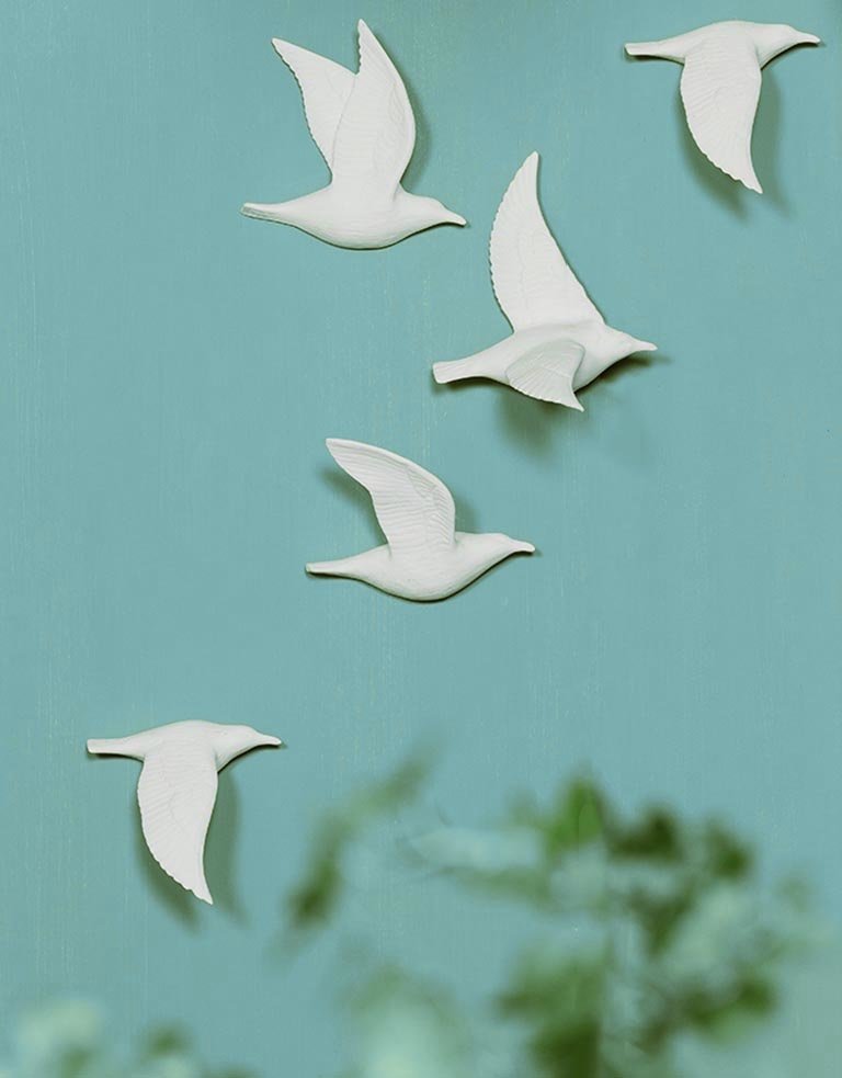 Set of five white  porcelain wall birds