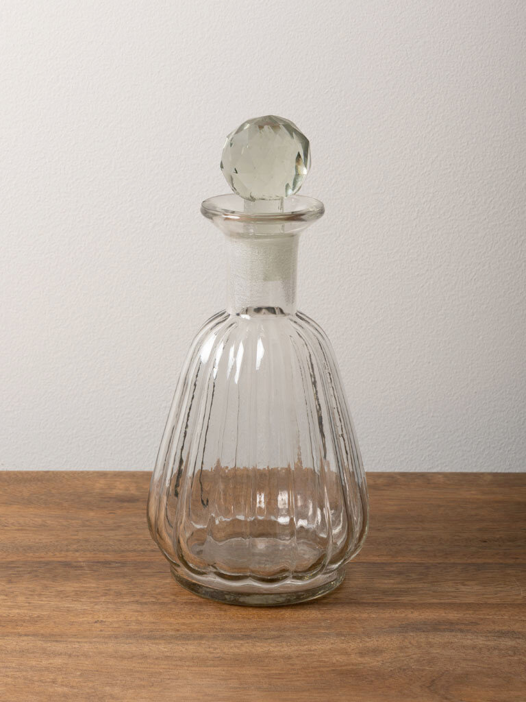 Round clear glass carafe with stripes and stopper
