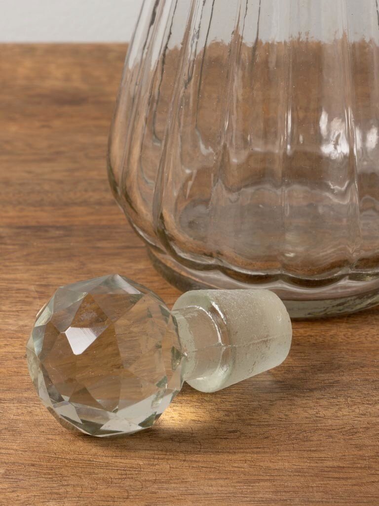 Round clear glass carafe with stripes and stopper