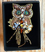 FAIRTRADE broche UIL met pailetten en kralen